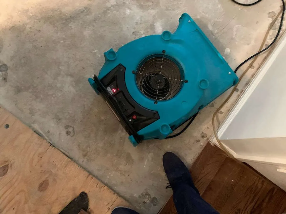 Air mover drying subfloor during Leak Detection & Repair in Stratmoor